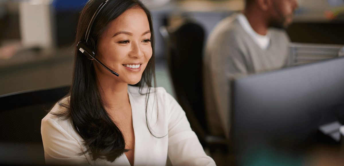 A women with headphone working at Interactive pty customer care support